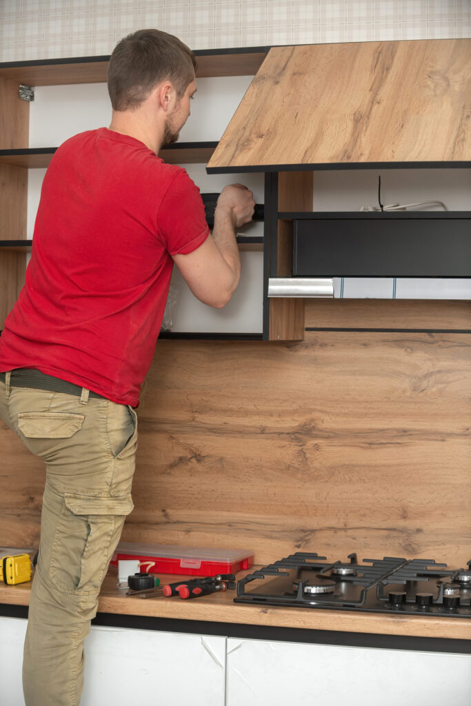 a craftsman installs a new kitchen